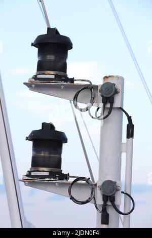 Navigation and radar equipment and antenna on the mast of cruise ship Stock Photo