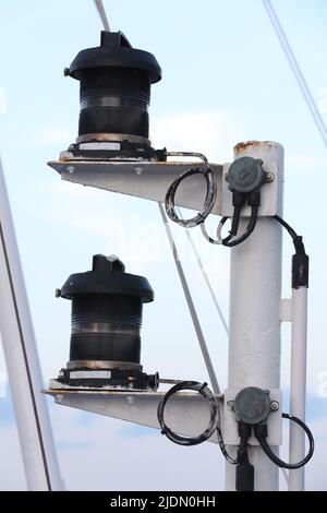 Navigation and radar equipment and antenna on the mast of cruise ship Stock Photo