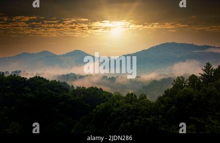 Sun beginning to set over the Blue Ridge Mountains in western North Carolina Stock Photo