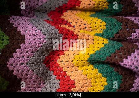 Grandma's plaid. Colored fabric. Knitted fabric. Texture is cozy blanket. Stock Photo