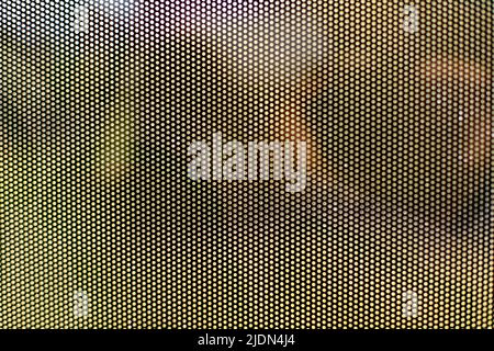 Mesh texture on glass. Shooting window. Small cage. Textured surface. Stock Photo