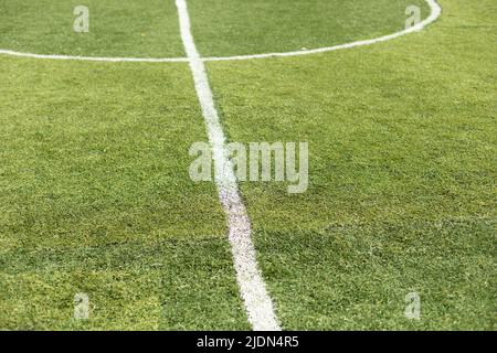 Marking of football field. White stripe on green grass. Sports stadium. Details of football. Stock Photo