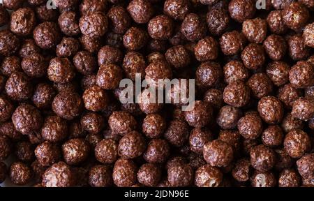 Chocolate corn balls as breakfast background and texture Stock Photo