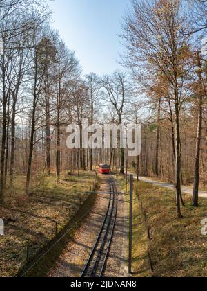 Zurich, Switzerland - March 26th 2022 - Red waggon of the Dolder cog railway  Stock Photo