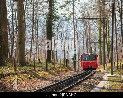 Zurich, Switzerland - March 26th 2022 - Red waggon of the Dolder cog railway  Stock Photo