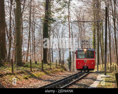 Zurich, Switzerland - March 26th 2022 - Red waggon of the Dolder cog railway  Stock Photo