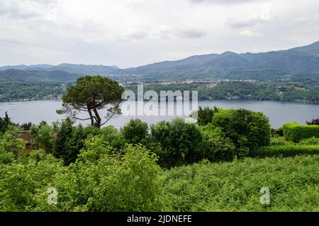 Landscape view of the Orta lake seen from a hiking path closed to its coast, in the picture the little island San Giulio is visible Stock Photo