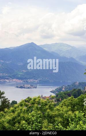 Landscape view of the Orta lake seen from a hiking path closed to its coast, in the picture the little island San Giulio is visible Stock Photo