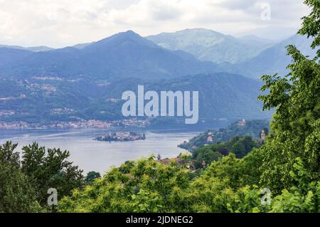 Landscape view of the Orta lake seen from a hiking path closed to its coast, in the picture the little island San Giulio is visible Stock Photo