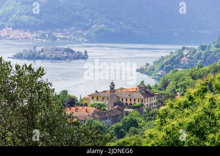 Landscape view of the Orta lake seen from a hiking path closed to its coast, in the picture the little island San Giulio is visible Stock Photo