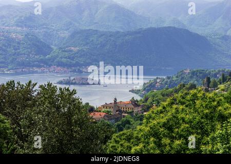 Landscape view of the Orta lake seen from a hiking path closed to its coast, in the picture the little island San Giulio is visible Stock Photo