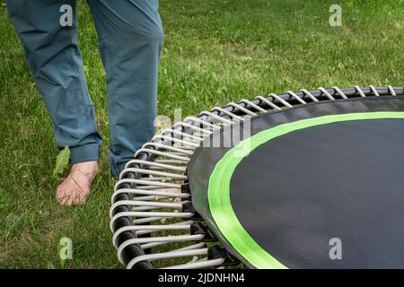 detail of mini trampoline for fitness exercising and rebounding in a backyard Stock Photo