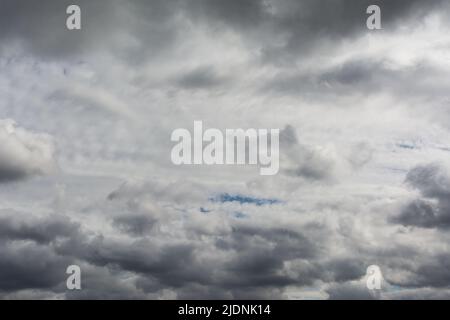 Very cloudy sky. Dark clouds before the storm. Stock Photo