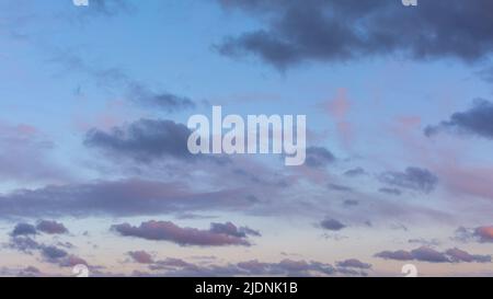 Sky. Small pink and purple clouds, just after sunset. Stock Photo