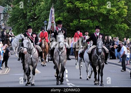 Peebles, UK. , . Beltane Wednesday - Cornets Installation, Rideout & Reel Cornet Iain Mitchell flanked by his Left & Right Hand men, leave to undertake the Riding of the Marches. ( Credit: Rob Gray/Alamy Live News Stock Photo