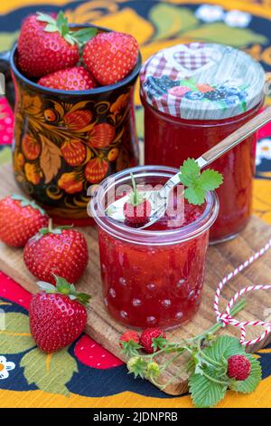 strawberry jam in glass and fresh strawberries Stock Photo