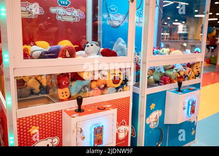 26 May 2022, Antalya, Turkey: Arcade coin operated machine to win a toy or lose money Stock Photo