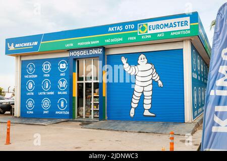 26 May 2022, Antalya, Turkey: Michelin popular brand tyre store. Famous mascot at the entrance to the shop Stock Photo