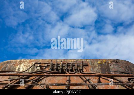 Details of steam locomotive standing outside of historic locomotive shed. The shot was taken in natural lighting conditions Stock Photo