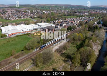 Smithy Bridge, Greater Manchester, UK. 195112 1J08 1058 Manchester Victoria to Leeds passing Smithy Bridge train station. 20th April 2022. Stock Photo