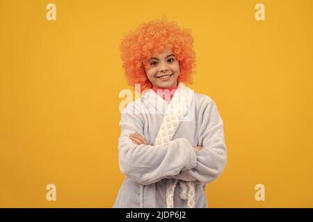 good morning. childhood happiness. birthday or pajama party. funny kid in curly clown wig Stock Photo