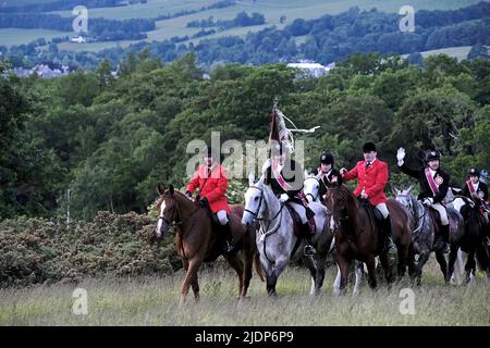 Peebles, UK. , . Beltane Wednesday - Cornets Installation, Rideout & Reel Peebles Cornet Iain Mitchell carries the flag on the traditional riding of the Marches. ( Credit: Rob Gray/Alamy Live News Stock Photo