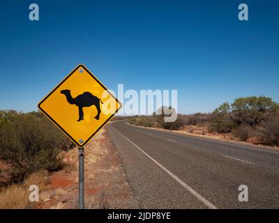 Camel warning traffic sign on the side of a central Autralia road in the Northern Territory.. Stock Photo