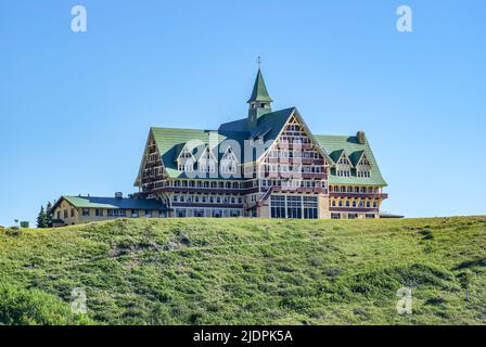 Waterton, Alberta Canada- June 14 2010: The Historic Prince of Wales Hotel sits hillside amongst the mountains of Glacier National Park. Stock Photo