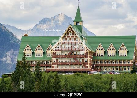 Waterton, Alberta Canada- June 14 2010: The Historic Prince of Wales Hotel sits hillside amongst the mountains of Glacier National Park. Stock Photo