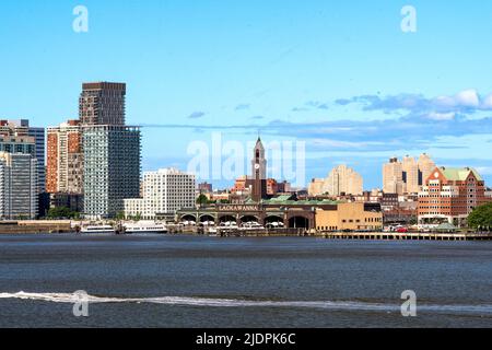 Hoboken, NJ - USA - June 18, 2022 A landscape view of the historic Hoboken Terminal, NY Waterway-operated ferries and the skyline of Hoboken's waterfr Stock Photo