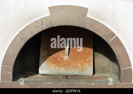 Russian stove for heating. Folk cuisine. Big stove. Place to warm up food. Stock Photo