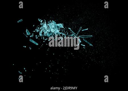 Small pieces of broken blue glass isolated on black background. Texture of broken glass. Stock Photo