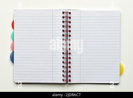Open notebook with white lined pages, isolated on white background Stock Photo