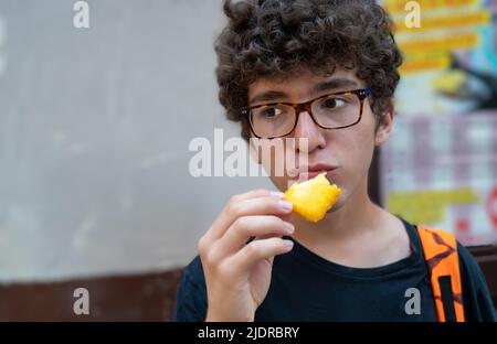 Bari,Puglia,Italy.August 2021. In the historic center, the old bari,street food: slices of polenta fried in boiling oil, specialties called sgagliozze Stock Photo
