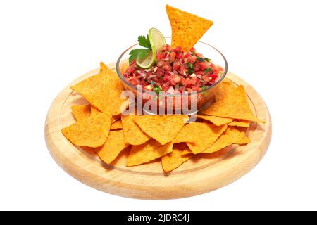 Glass bowl of tomato salsa dip with Tortilla chips isolated on white background Stock Photo
