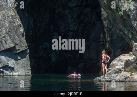 Bathing tourists in front of the Orrido di Sant Anna gorge on the Cannobino river in Valle Cannobina, Cannobio, Piedmont, Italy, Europe Stock Photo