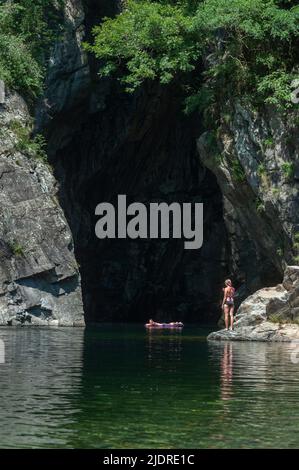 Bathing tourists in front of the Orrido di Sant Anna gorge on the Cannobino river in Valle Cannobina, Cannobio, Piedmont, Italy, Europe Stock Photo