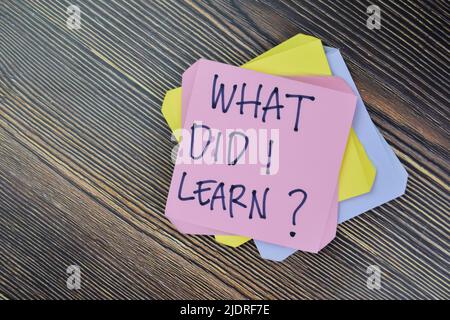 Concept of What Did I Learn? Personal Development write on sticky notes isolated on Wooden Table. Stock Photo