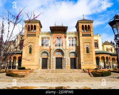 The Mudejar Pavilion designed by Anibal Gonzalez and built in 1914 houses the Museum of Arts and Popular Customs of Seville (Museo del Artes y Costumbres Populares) in Maria Luisa Park - Seville, Spain Stock Photo