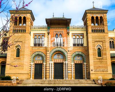 The Mudejar Pavilion designed by Anibal Gonzalez and built in 1914 houses the Museum of Arts and Popular Customs of Seville (Museo del Artes y Costumbres Populares) in Maria Luisa Park - Seville, Spain Stock Photo