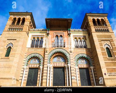 The Mudejar Pavilion designed by Anibal Gonzalez and built in 1914 houses the Museum of Arts and Popular Customs of Seville (Museo del Artes y Costumbres Populares) in Maria Luisa Park - Seville, Spain Stock Photo