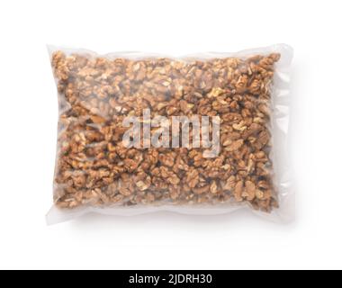 Top view of shelled walnut kernels in transparent plastic bag isolated on white Stock Photo