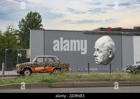 The Berlin Wall was a guarded concrete barrier that physically and ideologically divided Berlin from 1961 to 1989 as well as encircling and separating Stock Photo