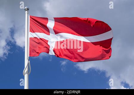 flag of Denmark flying in the wind Stock Photo