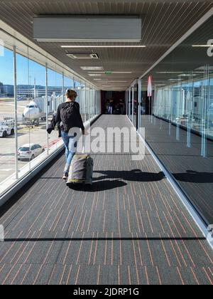 Boarding an airplane at the airport Charles de Gaulle in Paris, France Stock Photo
