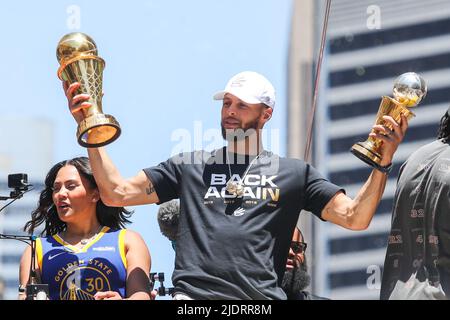 Golden State Warriors' Stephen Curry (30) holds up his MVP trophies as his wife Ayesha Curry looks on during the Championship Parade on Market Street in San Francisco, on Monday, June 20, 2022. (Photo by Ray Chavez/Bay Area News Group/TNS/Sipa USA) Stock Photo