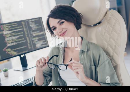Portrait of attractive experienced skilled cheery girl technician html coder hacker expert at work place space indoors Stock Photo