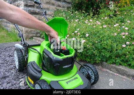 A Greenworks Lithium battery-powered Lawnmower. Stock Photo