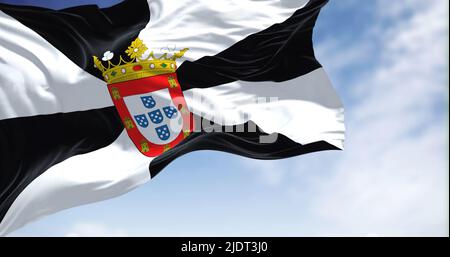 Rear view of Ceuta city flag waving in the wind on a clear day. Ceuta is a Spanish autonomous city on the north coast of Africa. Selective focus Stock Photo