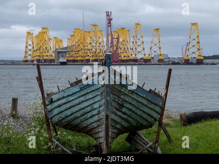 Wind turbine bases waiting to be relocated out in the North Sea, photographed at port in Cromarty, Scotland UK. Stock Photo